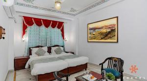 a hotel room with a bed and a window at Zostel Udaipur in Udaipur +39 photos
