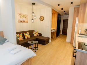 a living room with a bed and a couch at ToRo Hospitality in Mostar