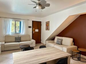a living room with a couch and a table at Leme Bedje - By Bobbywashere in Santa Maria