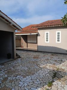 a stone driveway in front of a house at Casa Laguna in Laguna