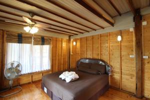 מיטה או מיטות בחדר ב-Longbay Lipe