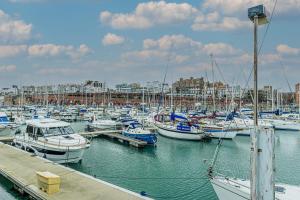 a bunch of boats docked in a harbor at The Courthouse Stylish Serviced Living in Ramsgate