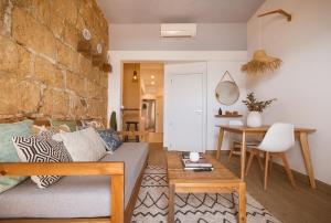 a living room with a couch and a table at The Wave House in Jávea