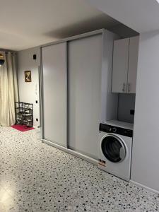 a kitchen with a washer and dryer in a room at Апартаменти біля АС-1 Зацепи in Lutsk
