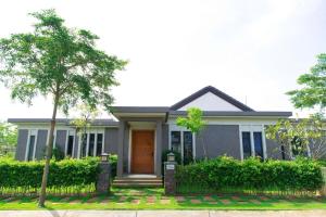 a house with a fence in front of it at SEACoastar in Xuyên Mộc