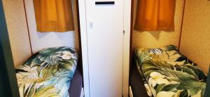 a room with a white door and a couch at Bed and Breakfast Op het Broek in Harfsen