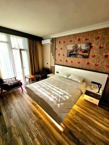 a bedroom with a large bed in a room at Akgül Otel in Malatya