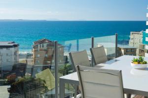 a view from a balcony overlooking the ocean at Sevan Apartments Forster in Forster