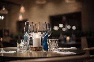 a table with three wine glasses on a table at Scandic Frankfurt Museumsufer in Frankfurt