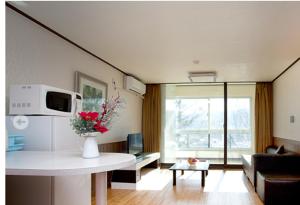 a living room with a couch and a table at Berion Reosrt in Pyeongchang