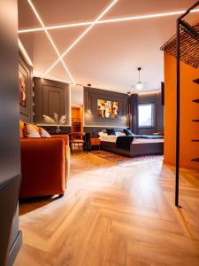 a large living room with a couch and a table at Premier Rooms in Szarvas