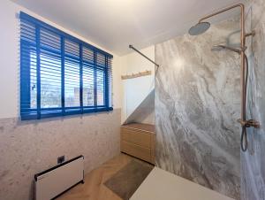 a bathroom with a shower and a sink at PS Casa in Hasselt +8 photos