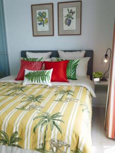 a bedroom with a bed with palm trees on it at 4 Bedroom Luxury Suite at Baan Kieng Fah in Hua Hin