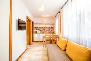 a living room with a couch and a table at Mare Nostrum in Kaş