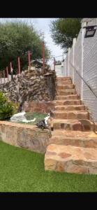 a set of stone steps in front of a house at Tourmaline GuestHouse in Windhoek
