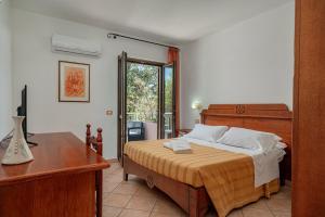 Vuode tai vuoteita majoituspaikassa Hotel Ispinigoli
