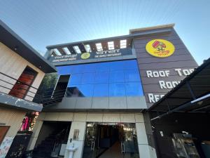 a building with a sign on the front of it at Firangi Chacha in Bāra Banki +2 photos
