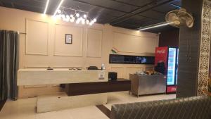 a room with a kitchen with a counter in it at Firangi Chacha in Bāra Banki