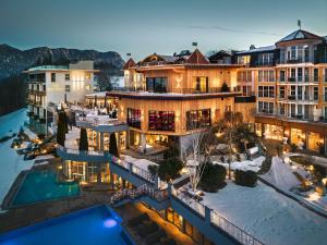 an aerial view of a resort with a pool at Hotel Panorama Royal in Bad Häring