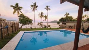 a swimming pool with a view of the water at Turtle Cove Resort in Siviri
