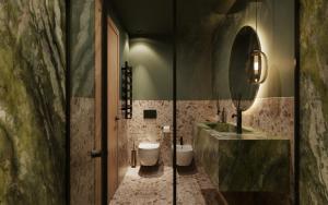 a bathroom with a toilet and a sink and a mirror at Post Residence - Home of Memories - Dolomites in San Candido +29 photos