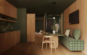 a living room with a table and a bed at Post Residence - Home of Memories - Dolomites in San Candido