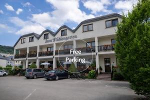 a building with a sign that reads free parking at Mühlengarten by Zzzimple in Nittel +36 photos
