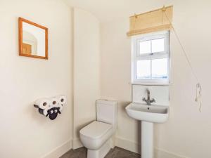 a bathroom with a toilet and a sink at 2 Bed in Mindrum oc-86637 in Carham +13 photos