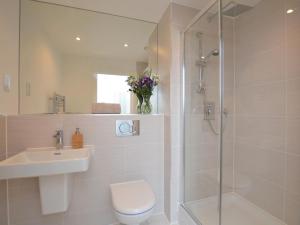 a bathroom with a shower and a toilet and a sink at 2 Bed in Bournemouth oc-48516 in Bournemouth +12 photos
