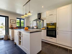 a kitchen with white cabinets and a counter top at 2 Bed in Belford oc-92196 in Ellington