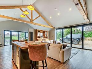 a kitchen and living room with a couch and a table at 1 Bed in Leeds oc-89862 in Sherburn in Elmet +9 photos