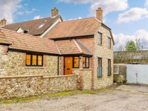 an old brick house with a stone wall at 1 Bed in Chard oc-91135 in Cudworth