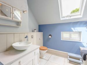 a bathroom with a white sink and a toilet at 4 Bed in Salisbury oc-82799 in Winchester +15 photos
