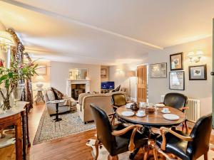 a living room with a table and chairs at 3 Bed in Morpeth oc-61257 in Harbottle
