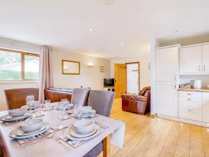 a dining room with a white table and chairs at 3 Bed in Wareham oc-dc157 in Stoborough