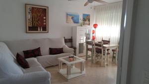 a living room with a couch and a table at Aguadulce Beach in Aguadulce