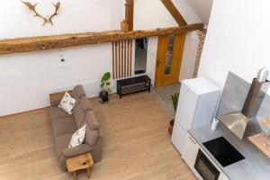 an overhead view of a living room with a couch at Timeless Barn in Ljubljana