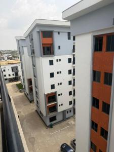 a view of a building from a balcony at Max Heights in Ikeja