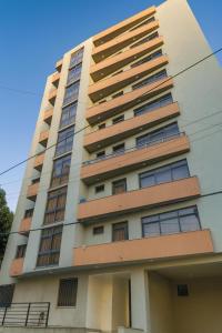 a tall building with many windows at HD Residential Apartment , Bole Dembel in Addis Ababa