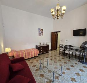 a living room with a couch and a table at Rosa Dei Venti in Amalfi