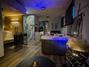 a room with a tub in the middle of a room at Day SPA Design Muhr in Wehlenberg +14 photos