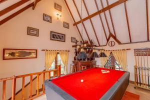 a room with a red pool table in it at Ard Lui Residence in Nuwara Eliya