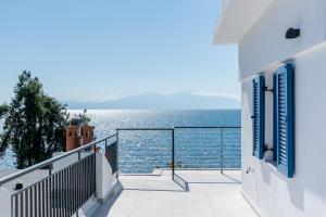 a balcony with a view of the ocean at Penthouse Seafront Luxury Studio in Epanomi