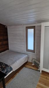 a bedroom with a bed and a window at Scandidim Lutsk in Lutsk +37 photos