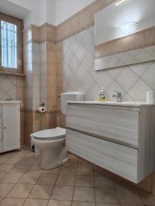 a bathroom with a toilet and a sink at Casa Vacanze Valcomino in Gallinaro +31 photos