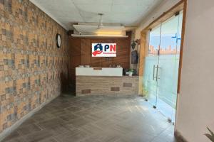 a bathroom with a sink and a clock on the wall at Premium Nest, Golf Course Road in Gurgaon