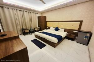 a hotel room with a bed and a desk and a desk at Premium Nest, Golf Course Road in Gurgaon +26 photos