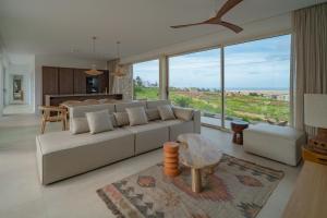 a living room with a couch and a table at Villa Gypsy by Aura Collection in Tindaya