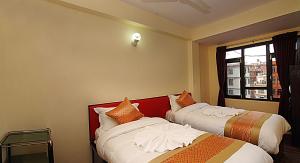 Rúm í herbergi á Hotel Gallery Nepal