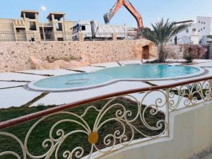 a view of a swimming pool from a balcony at Sea simple haven in Sharm El Sheikh